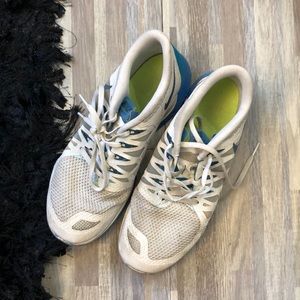 White and blue Nike men’s  9 woman’s  10 1/2 or 11